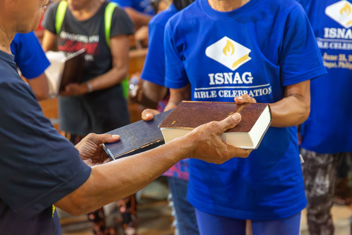 Isnag people exchanging their New Testament for a complete Bible.